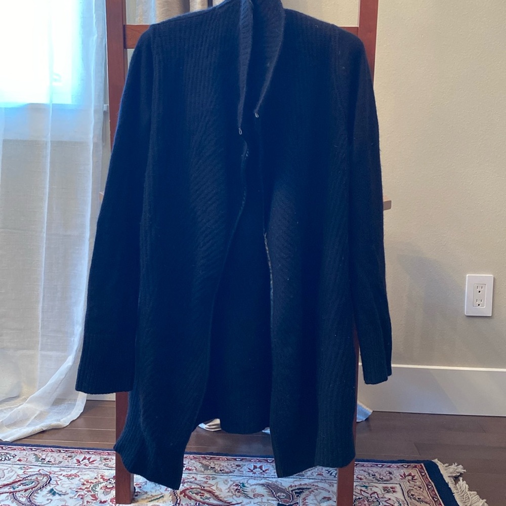 Ply cashmere cardigan with leather trim.